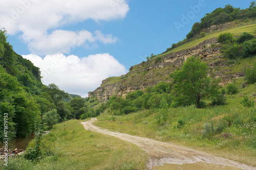 Landscape with road in mountain gorge in foothills of North Caucasus.