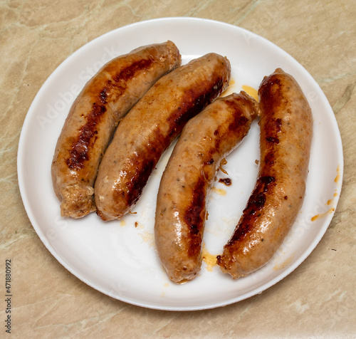 Fried meat sausages in a pan, food for men.