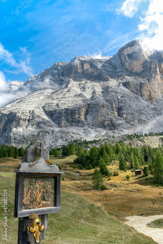 A historical wayside shrine at a hiking path undeneath the Sasso di Santa Croce mountain photo