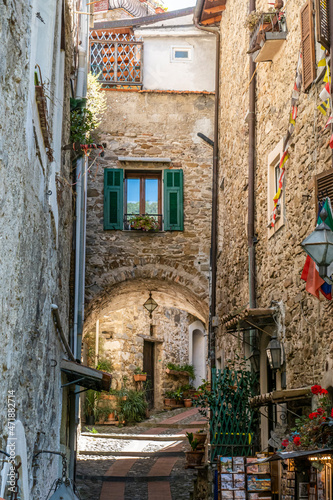 Fototapeta Naklejka Na Ścianę i Meble -  Characteristic small streets in the historic center of Dolceacqua with arches and flowers