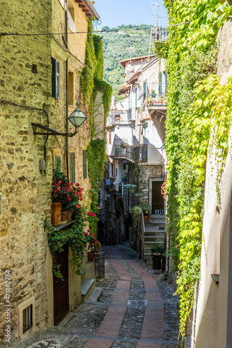 Fototapeta Naklejka Na Ścianę i Meble -  Characteristic small streets in the historic center of Dolceacqua with arches and flowers