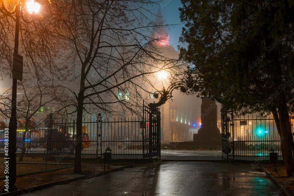 Street lights foggy misty night lamp post lanterns city road. Night fog park