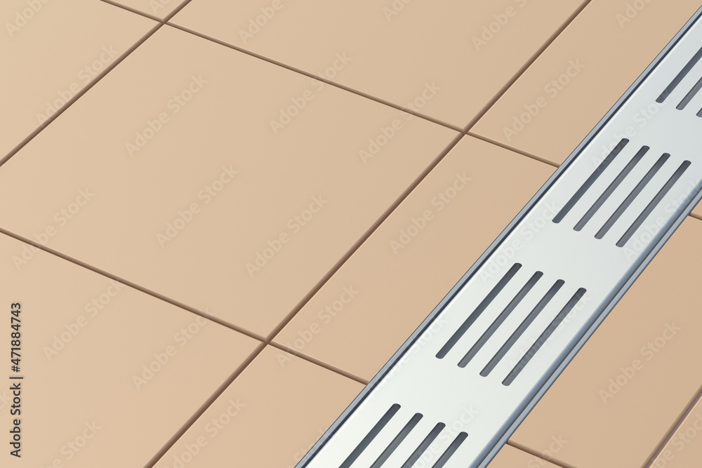 Long rectangular shower drain with stainless grid in bathroom on floor ...