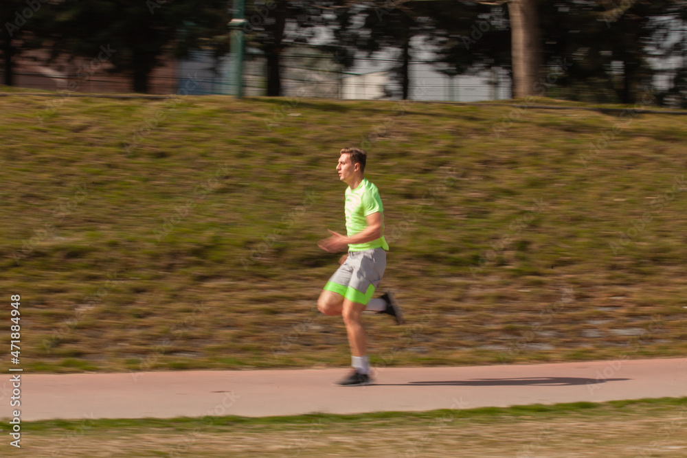 Guy is running in selective focus