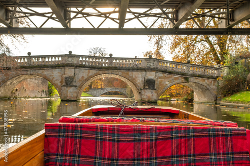 The Clare Bridge over the River Cam during a private punting tour along Cambridge Backs on the River Cam in the city of Cambridge, UK. Captured on a bright and sunny autumn day, November 2021. photo