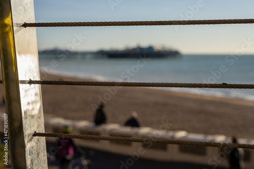 Pier and sea through cable railings