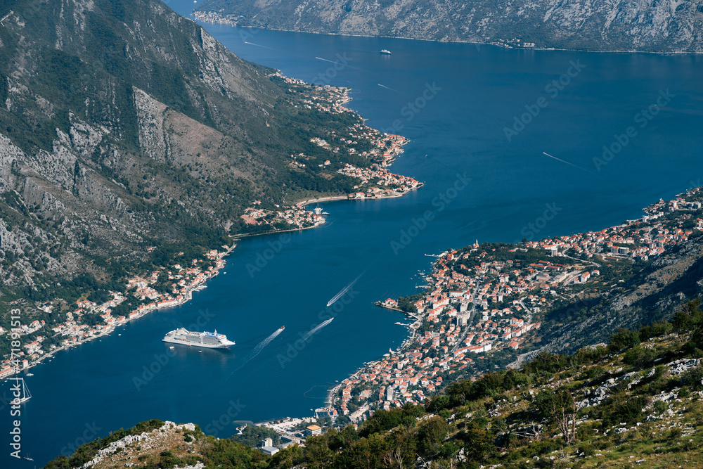 Cruise ship is in the Bay of Kotor. Mount Lovcen