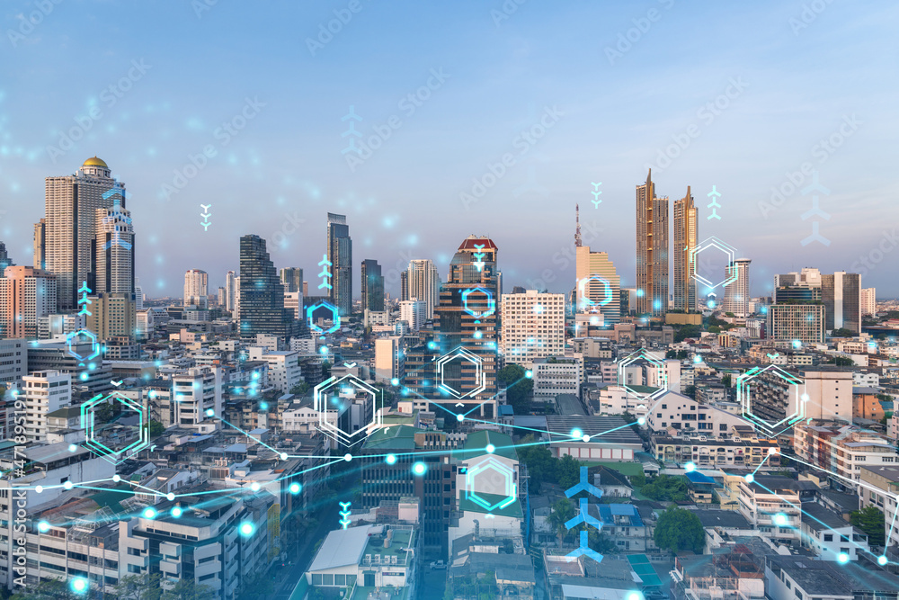 Fototapeta premium Glowing hologram of technological process, aerial panoramic cityscape of Bangkok at sunset. The largest innovative hub of tech services in Southeast Asia. Multi exposure.