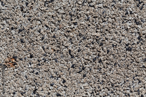 Crushed granite stones wall - close up © romantsubin
