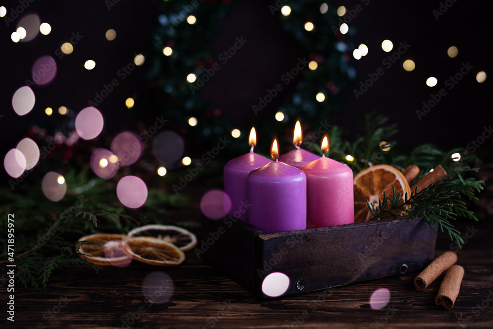 Four purple burning advent candles, Christmas eve. Four purple burning advent candles, Christmas eve.