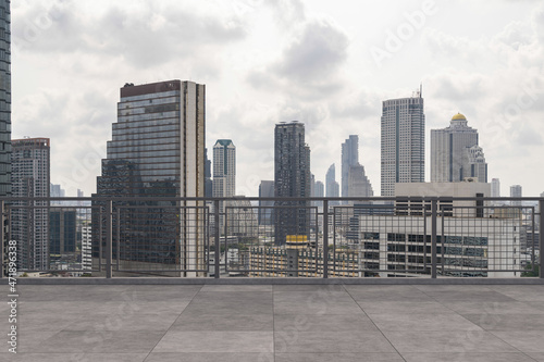 Panoramic Bangkok skyline view  concrete observatory deck on rooftop  daytime. Luxury Asian corporate and residential lifestyle. Financial city downtown  real estate. Product display mockup empty roof