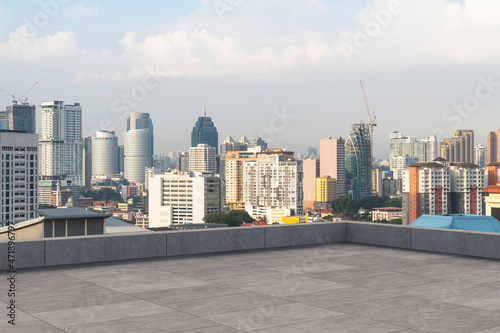 Panoramic Kuala Lumpur skyline view, concrete observatory deck on rooftop, daytime. Asian corporate and residential lifestyle. Financial city downtown, real estate. Product display mockup empty roof © VideoFlow