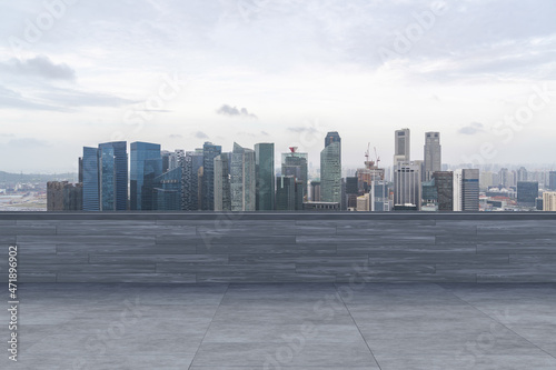 Panoramic Singapore skyline view, concrete observatory deck on rooftop, daytime. Asian corporate and residential lifestyle. Financial city downtown, real estate. Product display mockup empty roof