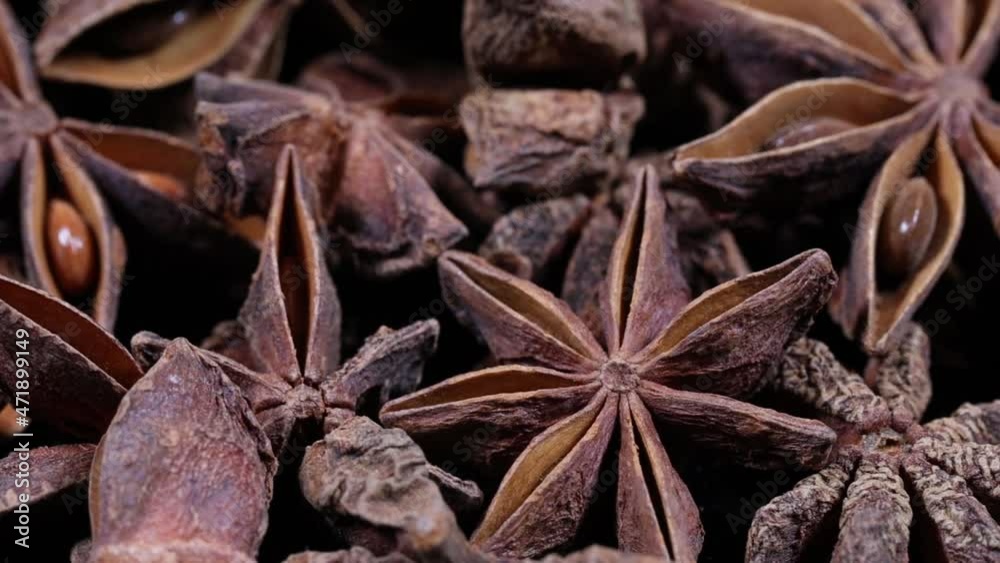pile of star anise extreme close up with rotation