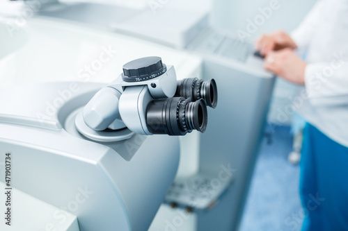 Fototapeta Naklejka Na Ścianę i Meble -  Microscopic apparatus for testing eyesight. Ophthalmology and treatment of eye diseases. Eye clinic, optometrist concept