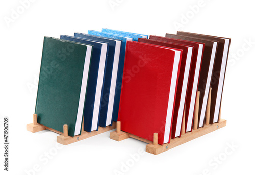 Colorful books in wooden ho...