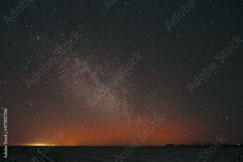 Real Night Sky Stars Background With Natural Colourful Sky Gradient. Sunset  Sunrise Light And Starry Sky. Yellow And Black Colors Over Horizon