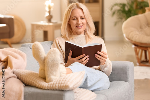 Beautiful mature woman read...