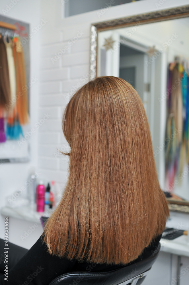 Long brown hair on woman in beauty salon