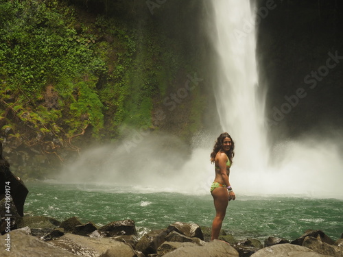 young woman hiking in the jungle in costa rica