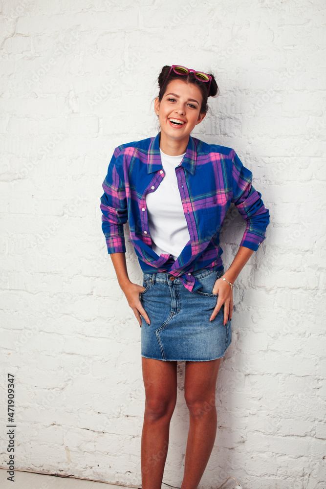 young pretty stylish hipster girl posing emotional isolated on white background happy smiling cool smile, lifestyle people concept