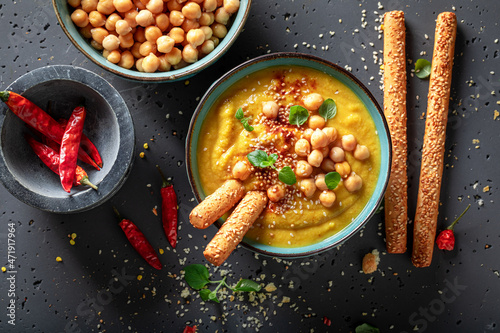 Vegan chickpea soup with sesame seeds and hot chilli pepper. photo