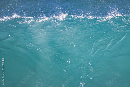 Crystal clear torquoise ocean wave as it breaks on Maui. © manuel