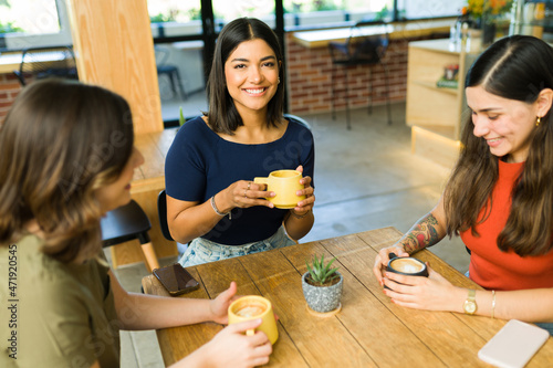 Multiracial women enjoying coffee