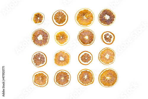 Dried oranges on white isolated background. Flatlay.