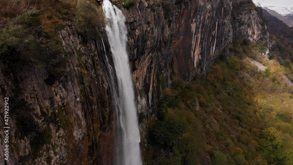 Giant waterfall inside a forest in autumn Giant waterfall inside a forest in autumn
