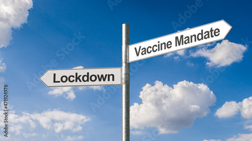 Картината върху платно Vaccine mandate concept: Road direction signs pointing to opposite directions Lockdown and Vaccine Mandate