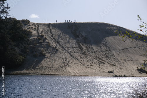 Sand surfing on the dunes, Oregon Dunes National Recreation Area photo