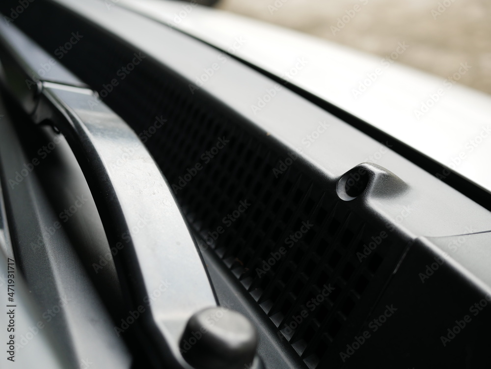 car wiper water nozzle or windshield washer pump on a car.
car wiper water nozzle or windshield washer pump on a car.