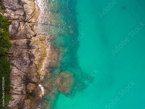 Aerial view Top down seashore Beautiful turquoise sea surface in sunny day Good weather day summer background Amazing sea in Phuket Thailand on November 23-2021