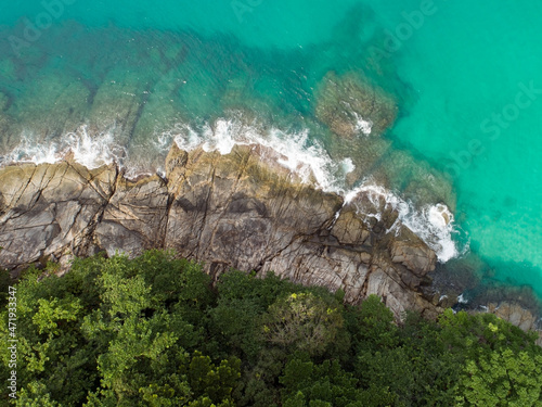 Aerial view Top down seashore Beautiful turquoise sea and mountain in sunny day Good weather day summer background Amazing sea in Phuket Thailand on November 23-2021 © panya99