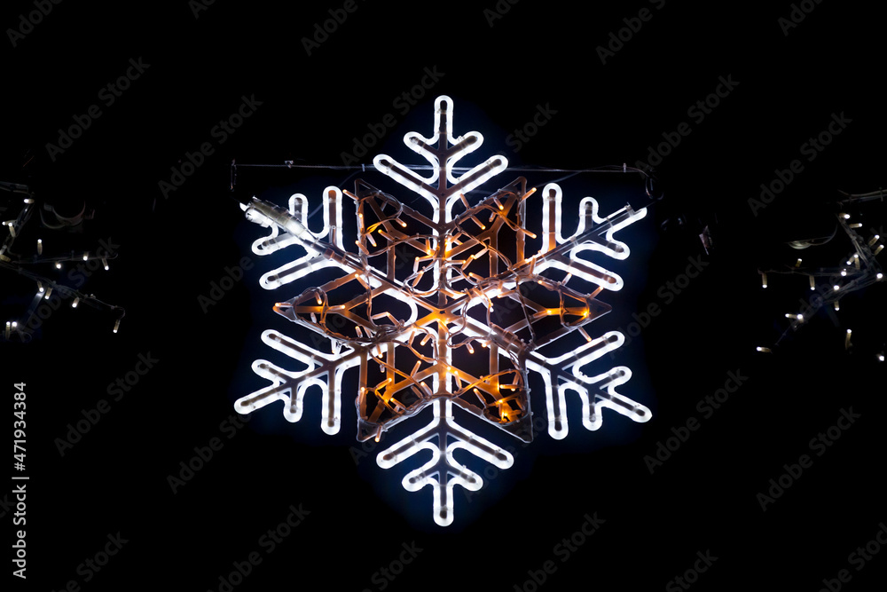 Snowflake light from a Christmas garland Snowflake light from a Christmas garland