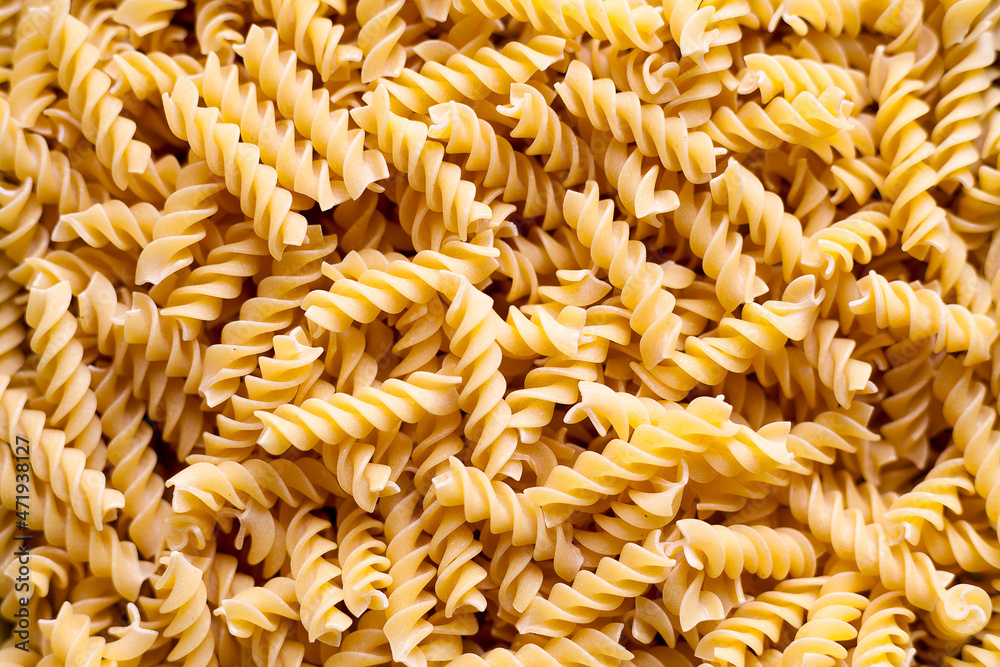 Stack of uncooked fusilli Stack of uncooked fusilli