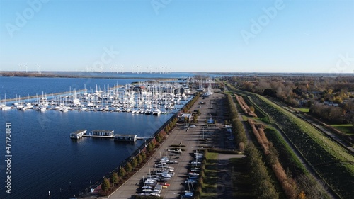 Harbor of Bruinisse in the Netherlands. Village in Schouwen-duiveland in the province of Zeeland. European fishing village with sailboats in the marina.