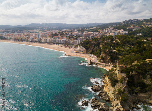 View from drone of Spanish town of Lloret de Mar on Mediterranean coast in summer day. photo