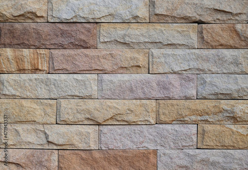 Close-up of modern brick block wall textured pattern for text backgrounds.