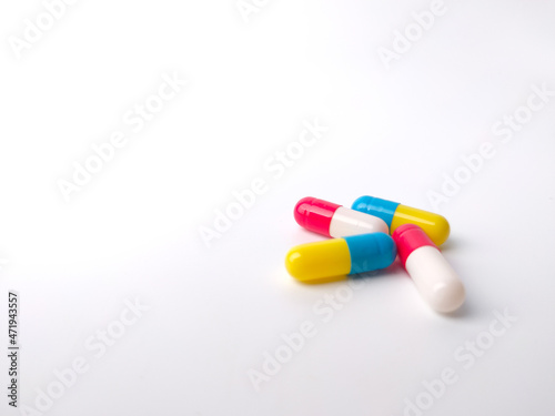 Piles of pills and capsule on white background,isolated,copy space.Selective focus.