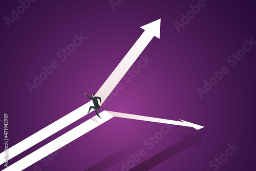 Businessman jump from falling arrows to rising arrows.