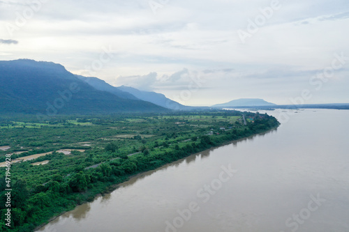 Aerial scenic view of the river against mountain in cloudy sky