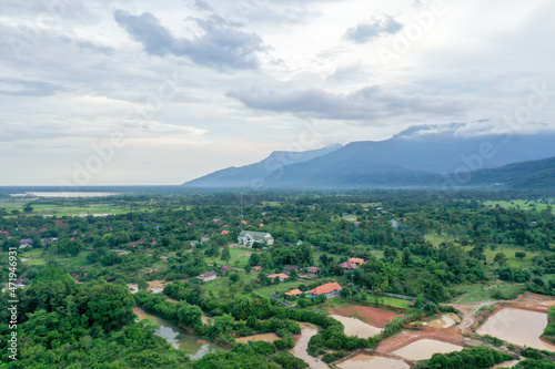 Aerial scenic view of the river against mountain in cloudy sky