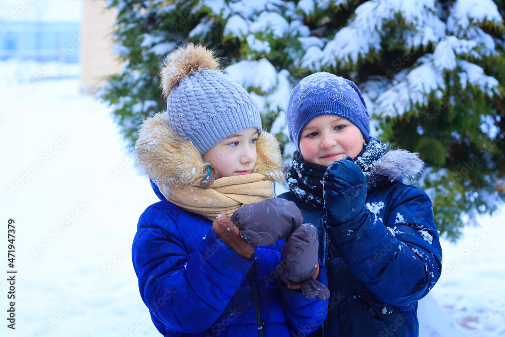 little girls play in the snow, throw snow, fall, have fun, talk and communicate little girls play in the snow, throw snow, fall, have fun, talk and communicate