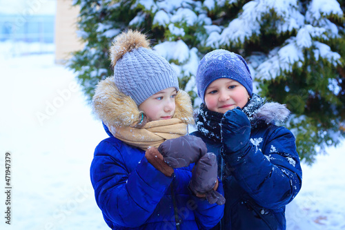 little girls play in the snow, throw snow, fall, have fun, talk and communicate