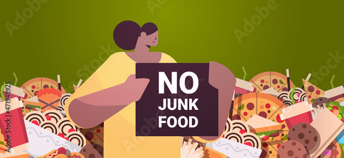 woman holding no junk food placard unhealthy nutrition junkfood addiction stop fast food concept