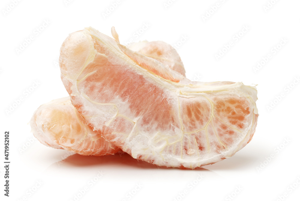 peeled pomelo pieces isolated on white background. Tasty fresh fruit eating concept. peeled pomelo pieces isolated on white background. Tasty fresh fruit eating concept.