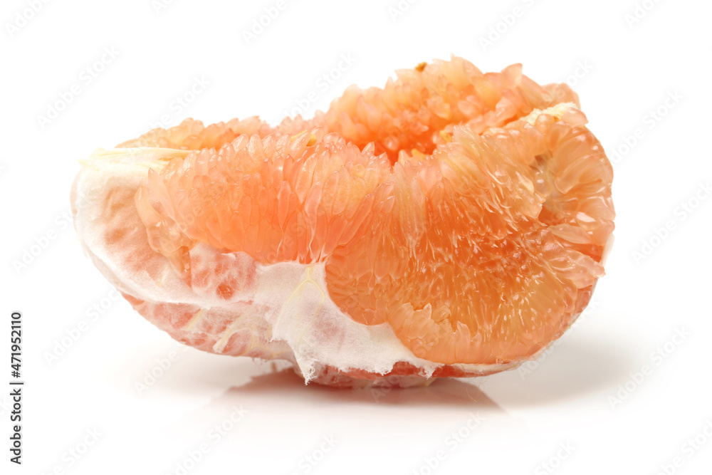 peeled pomelo pieces isolated on white background. Tasty fresh fruit eating concept. peeled pomelo pieces isolated on white background. Tasty fresh fruit eating concept.