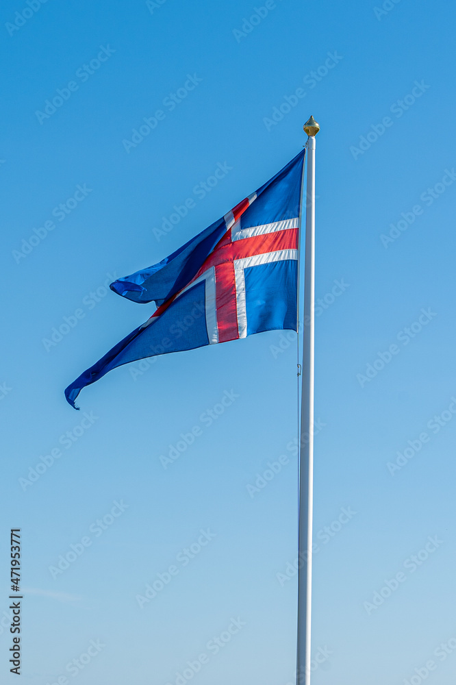 View of the beautiful Iceland Flag waving its beautiful Red, white and blue colors in the Thingvellir National Park 